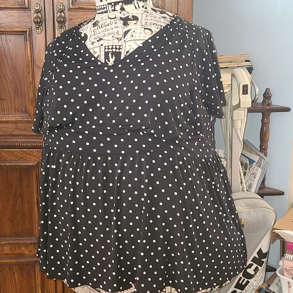 Black with white polka dot blouse.